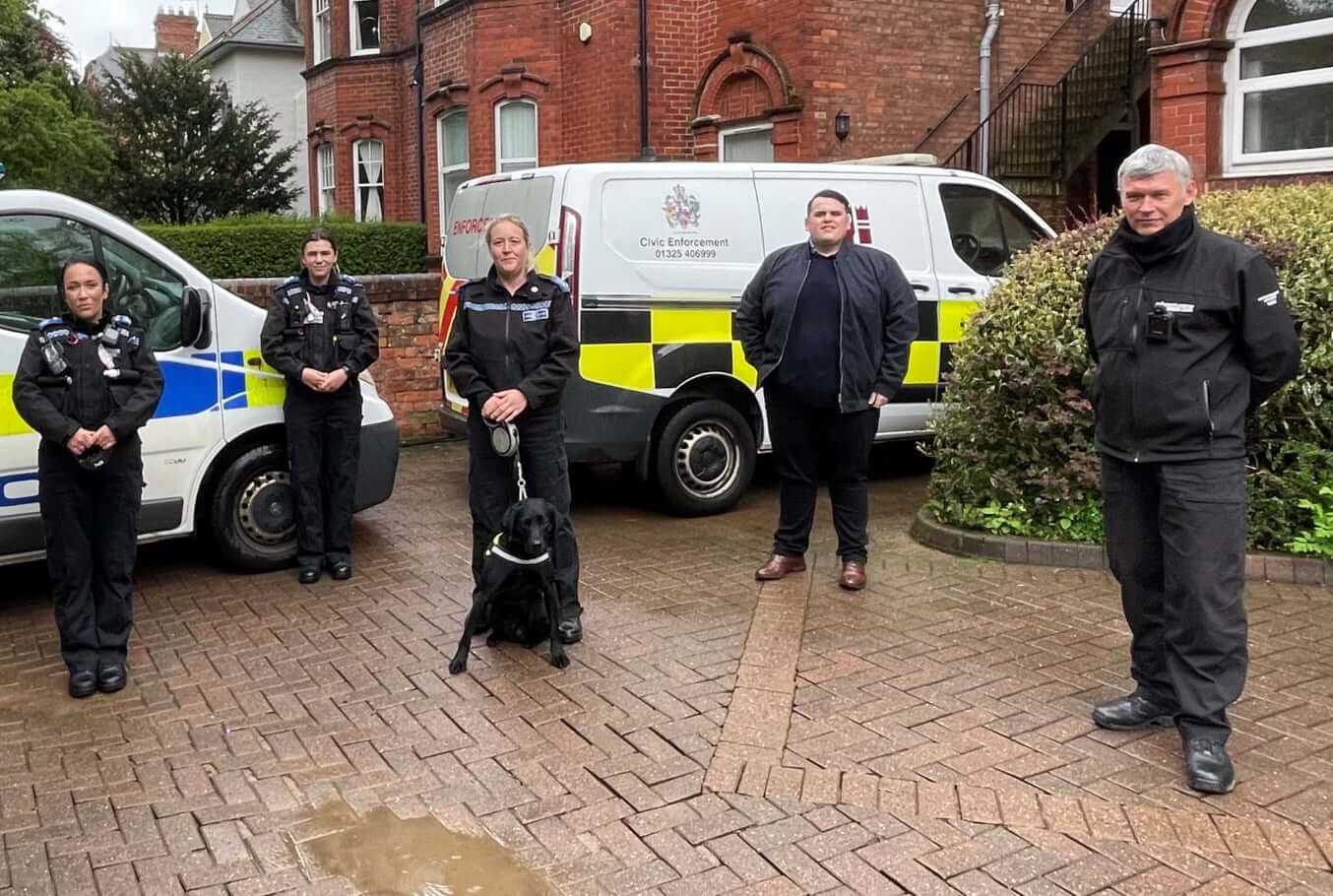 Police staff outside a Police Station